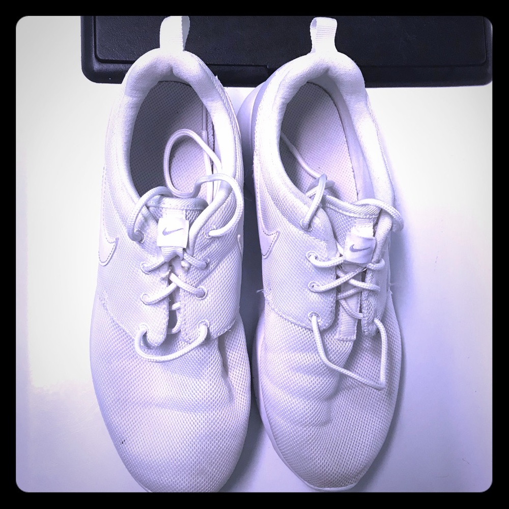 All white NIKE sneakers